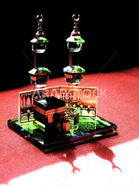 A small model of the Kaaba, the Qiblah of Islam and Muslims, Islamic religious destinations, holy places and landmarks in Mecca, black background