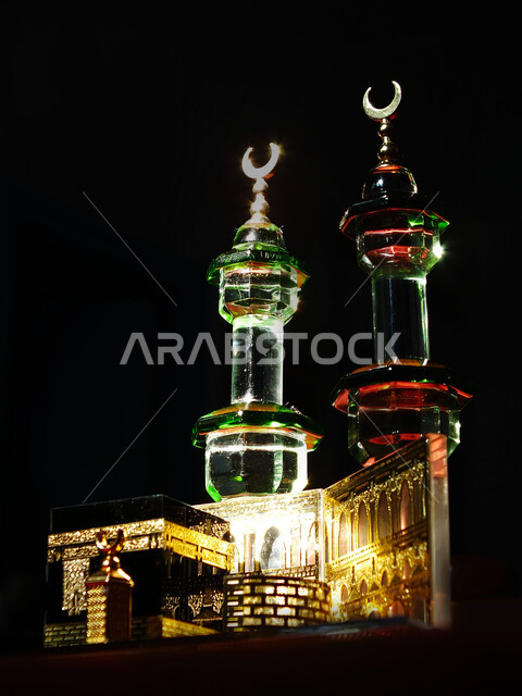 A small model of the Kaaba, the Qiblah of Islam and Muslims, Islamic religious destinations, holy places and landmarks in Mecca, black background