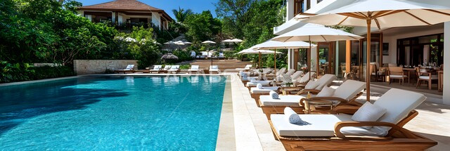 Comfortable places to lie by the pool, a concept for relaxation, meditation and getting away from work pressures, comfortable interior decorations and furniture for hotels in Saudi Arabia, interest in planting green plants, a swimming pool inside a luxury resort