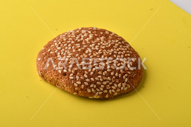 Image of crispy and crunchy wheat biscuits on a yellow background, close-up of delicious wheat biscuits