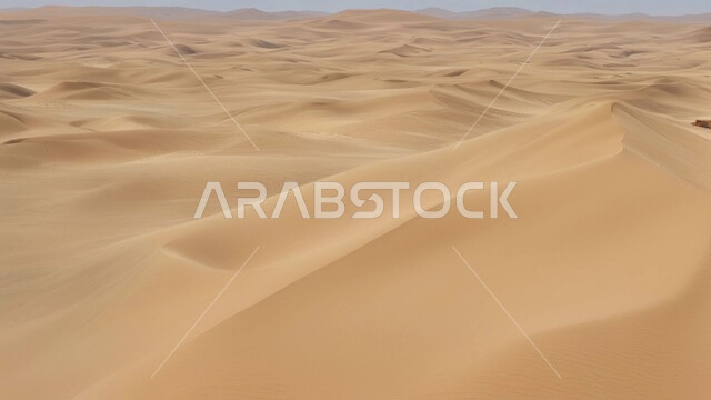 Terrain, elevations and peaks in the prairies, sand formations and formations in the desert of the Kingdom of Saudi Arabia, desert areas and desert environment during the day, dunes and hills of soft golden sand