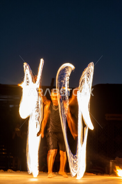 Fireworks displays in a desert camp in Dubai, activities and artistic performances, landscapes in the deserts of the United Arab Emirates, hot burning sparks, attracting and attracting tourists from all over the world