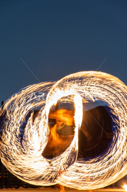 Fireworks displays in a desert camp in Dubai, activities and artistic performances, landscapes in the deserts of the United Arab Emirates, hot burning sparks, attracting and attracting tourists from all over the world