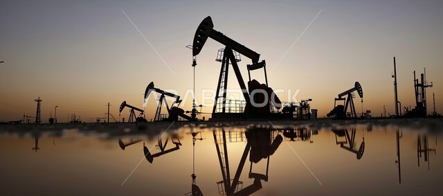 Petrochemical industries and projects in the Kingdom, Panoramic image of huge drilling machines used to extract oil from the sea at sunset, Exploration for underground resources in Saudi Arabia, Quality of tools and equipment for the manufacture and storage of oil