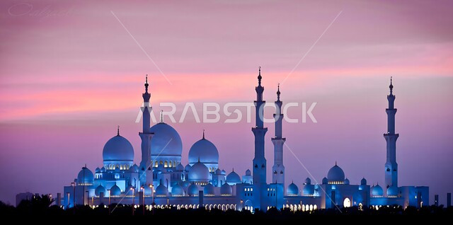 Modern architectural engineering art of mosques, the outer courtyard of the mosque, performing prayers and striving in worship and getting closer to God, domes and minarets in the Islamic style, the famous Sheikh Zayed Mosque in Abu Dhabi at sunset, sacred Islamic religious places and landmarks in the United Arab Emirates