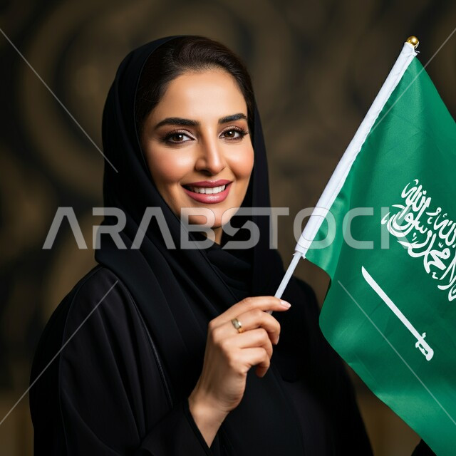 ذكرى العيد الوطني السعودي 23 سبتمبر, صورة مقربة لامرأة عربية سعودية خليجية محجبة ترتدي العباءة السوداء تحمل بيدها علم السعودية للاحتفال بيوم العلم 11مارس, التعبير عن الفخر والاعتزاز بالانتماء للمملكة