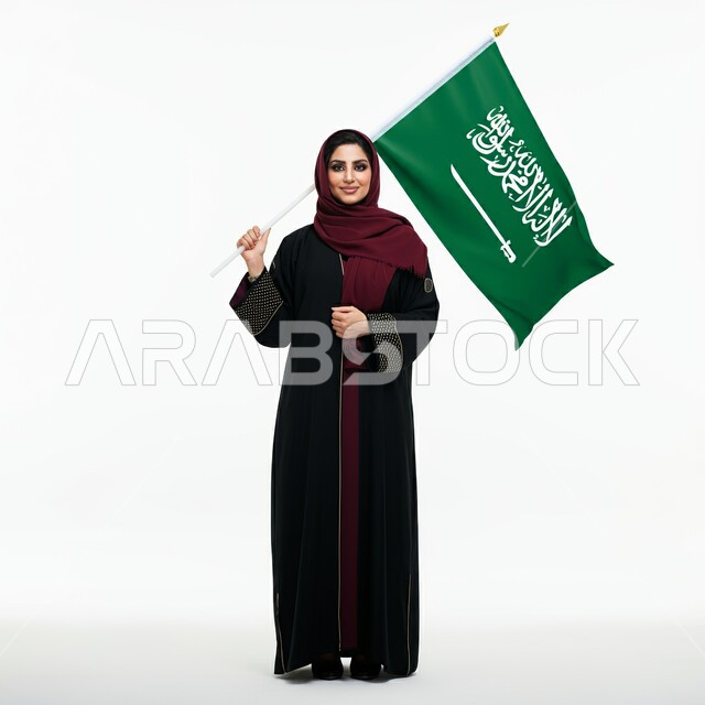 التعبير عن الفخر والاعتزاز بالانتماء للمملكة, ذكرى العيد الوطني السعودي 23 سبتمبر, صورة مقربة لامرأة عربية سعودية خليجية محجبة ترتدي العباءة السوداء تحمل بيدها علم السعودية للاحتفال بيوم العلم 11مارس
