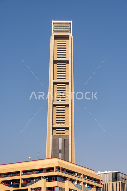 Modern skyscraper in Dubai during daytime, distinctive architectural designs of towers, commercial and residential buildings and facilities in the United Arab Emirates