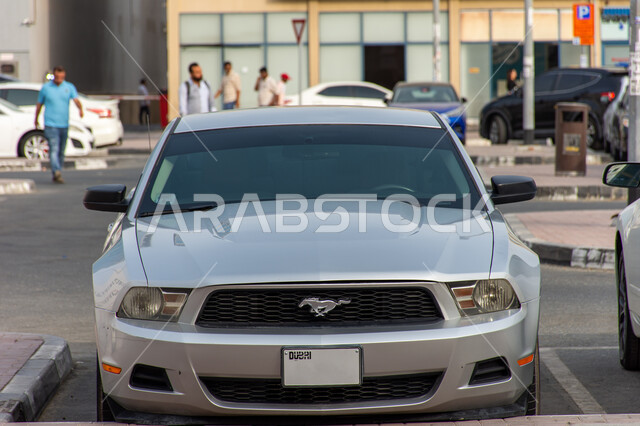 Grey Mustang car parked in Dubai, Modern land transportation, Unique luxury sports car brands, Exhibitions and events in UAE