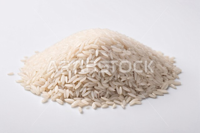 Rice crop, uncooked white rice, white rice scattered on the ground, agricultural crops, portrait image with white background full of rice grains