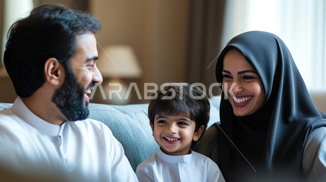 Expressions of joy and happiness, doing recreational activities with family members, sharing fun activities with children, happy family atmosphere, close-up photo of a Saudi Arabian Gulf family enjoying a good time at home