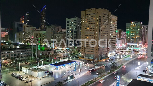 High-rise buildings, commercial and residential facilities illuminated at night, tourist places and landmarks in Saudi Arabia, architectural engineering art for building towers and skyscrapers in the modern style
