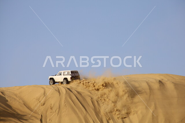 Popular competitions and events, racing on soft golden sands, Dakar Rally in Saudi Arabia, dirt-car racing in desert areas, exciting challenges and entertainment activities, World Rally Championship