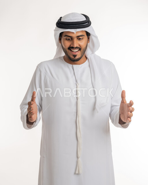 The concept of elegance and attention to external appearance, containing and holding an item, a close-up portrait of an Arab Gulf Emirati man wearing a kandora and turban, opening his hands to display three-dimensional holographic elements, white background.