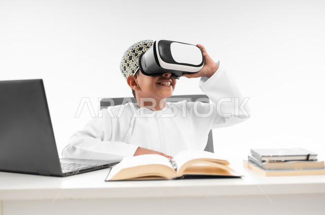 Advanced schools and academies, interaction with the virtual world, combining learning with entertainment using modern technology, following new educational methods, close-up portrait of an Arab Gulf Omani boy wearing a dishdasha and a kilt, wearing VR glasses, white background