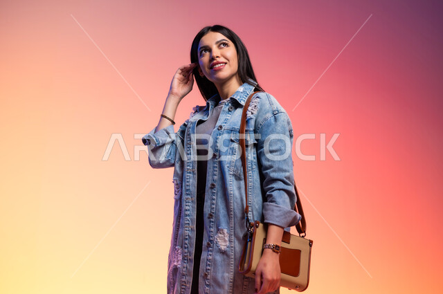 Features of femininity and softness, modern Gulf women's clothing, close-up portrait of a Saudi Gulf Arab woman, concept of fashion and elegance, fashion show and modern models, buying new clothes and accessories, colorful background