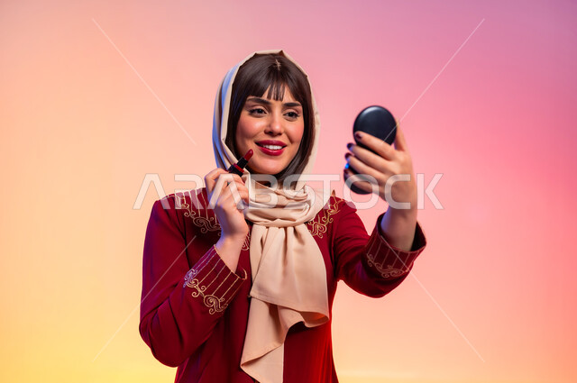Interest in femininity and appearance, modern Gulf women's clothing, portrait of a Saudi Arabian Gulf woman wearing an abaya applying makeup, concept of fashion and elegance, fashion show and modern models, buying new clothes and accessories, colorful background