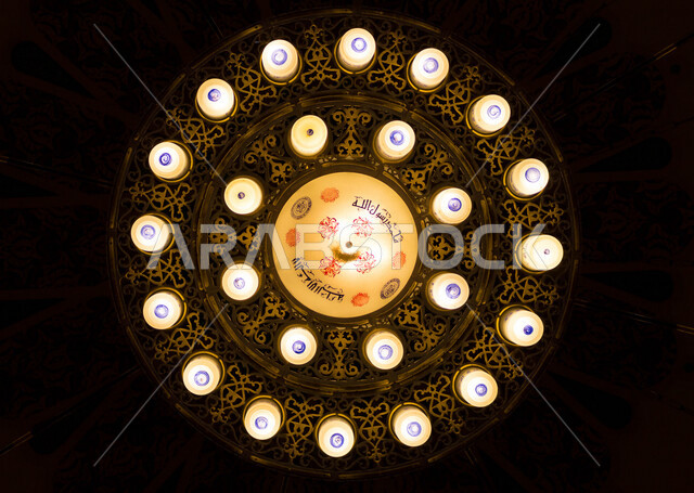 A group of luminous lanterns hanging on the wall ceiling, Ramadan lanterns, celebrating the coming of the holy month