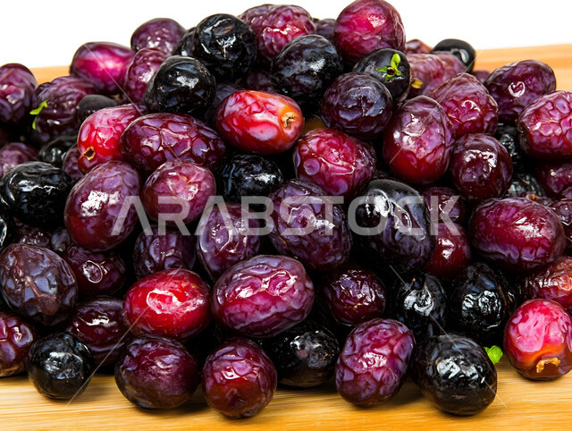 Healthy and high-value meal, different types of delicious dates, close-up of wrinkled braided dates, delicious Ramadan hospitality, sugar-rich foods, local national products in Saudi Arabia