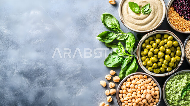 Healthy breakfast, close-up of a plate of olives, mutabbal and hummus on the breakfast table, a variety of cold appetizers, delicious food dishes, quality of local national products in Saudi Arabia, black background