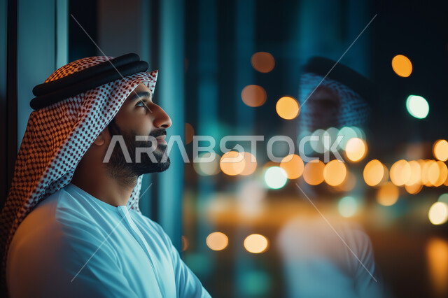 Modern women's hijabs, Close-up side view of a veiled Saudi Arabian Gulf woman wearing a black abaya smiling looking at something with gestures of self-confidence, interest in appearance, concept of softness and elegance