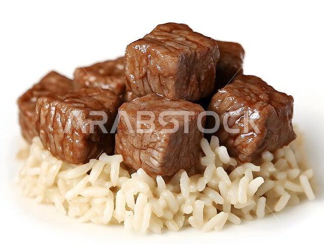 A plate of Kabsa rice with pieces of beef, traditional popular Arab banquets and dishes, recipes for delicious oriental foods and meals, kitchens and restaurants of the Kingdom of Saudi Arabia, a plate of the famous biryani, the skill of preparing the famous Gulf Mandi recipe with spices rich in flavors