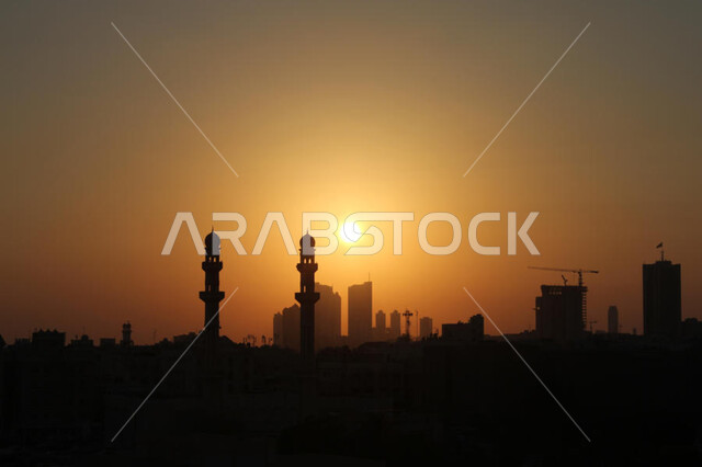 Worship and drawing closer to God Almighty, the call of Muslims to perform the obligatory prayers, a silhouette of the domes and minarets of Islamic mosques, the distinctive spiritual atmosphere, the architectural art in the ancient Arab-Islamic style