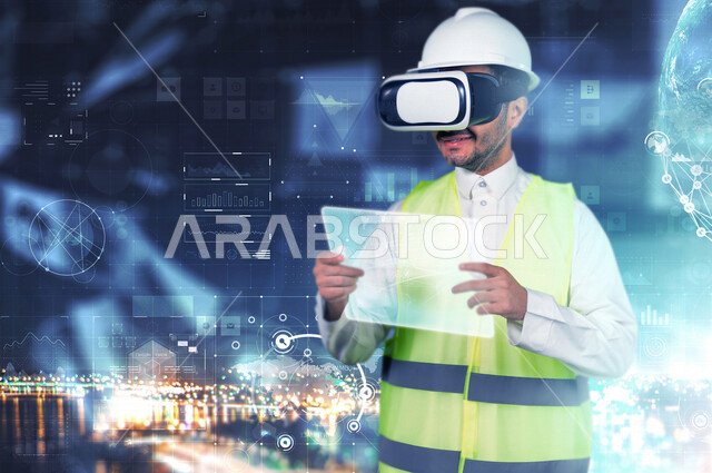 A close-up image of a young Saudi Arabian Gulf engineer wearing virtual reality glasses to see and use a network that contains a set of calculations, graphic statistics and an engineering icon using the advanced 3D hologram technology for engineering solu