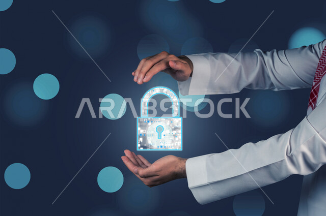 Close-up of the hand of a Saudi Arabian Gulf man holding in his hands a 3D hologram security lock, 3D hologram technology, protection and security