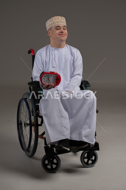 Constant reminders and alerts, punctuality, portrait of a Gulf Arab Omani man with special needs wearing a watch and a cuff, sitting on a reclining chair holding a small digital watch, completing tasks on time, gestures of happiness and pleasure, gray background