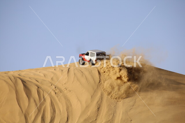 Conducting recreational activities and events to attract tourists, riding a car on sand dunes and hills, going on adventures using a four-wheel drive vehicle in the deserts of the Kingdom, the hobby of drifting with cars, driving vehicles in the Nawan desert in the Al-Baha region, participating in Saudi races