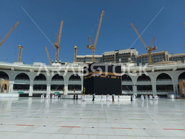 Pilgrims circumambulating the Kaaba, Umrah rituals in Mecca during the spread of the Corona virus in the Kingdom of Saudi Arabia, following preventive and safety measures against Covid 19, sacred Islamic religious places, performing worship and prayers and getting closer to God
