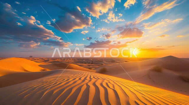 Formations and formations of golden sand in the Arabian Peninsula desert, dunes and soft sand hills formed in the Gulf deserts, terrain and dry environment in desert nature, sunset view in the sky over grains of sand