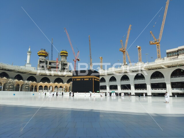 The situation of the Grand Mosque in Mecca during the days of the spread of the Corona virus in the Kingdom of Saudi Arabia, pilgrims circumambulating the Kaaba, performing the rituals of Umrah and Hajj in Mecca, following preventive and safety measures against Covid 19, sacred Islamic religious places and landmarks, performing worship and prayers and drawing closer to God