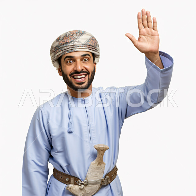 Looking at the camera with expressions of pleasure and cheerfulness, gestures of peace and welcome, close-up portrait of an Arab Gulf Omani man wearing a dishdasha and turban, placing a dagger on his waist, raising his hand up, white background