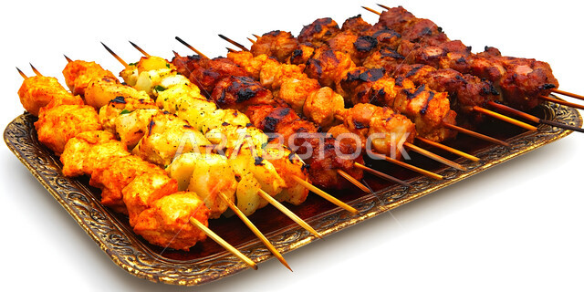 Eastern Arabic cuisine restaurants, a decorative metal plate of grilled meat skewers, Saudi cuisine recipes rich in distinctive flavours, foods rich in protein, a meal with high nutritional value, white background