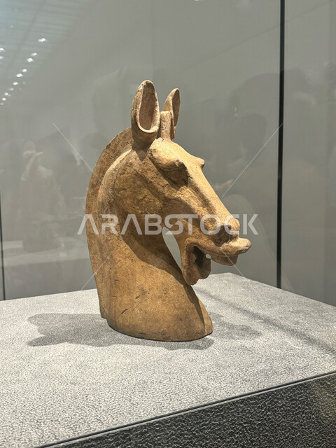 Authentic Arab heritage, historical landmarks in the United Arab Emirates, a model of a horse's head in the Louvre Museum in the Emirate of Abu Dhabi, love and passion for purebred Arabian horses, innovative artistic designs, a symbol of chivalry and courage