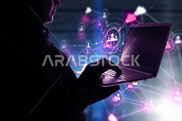 Digital transformation concept, integrating advanced technology with work, using modern technologies, close-up image of a veiled Saudi Arabian Gulf woman holding a laptop in her hand standing in front of illuminated 3D holographic icons and shapes, a technological future vision