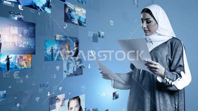 Promoting the concept of digital and technological development in Saudi society, using modern technologies, a close-up image of a veiled Saudi Arabian Gulf woman wearing an abaya holding papers reviewing data, icons and illuminated holographic elements