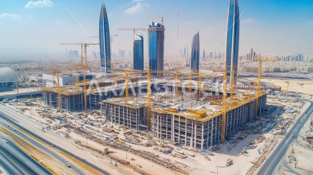 مبنى قيد الانشاء في المملكة العربية السعودية, الآلات والمعدات الثقيلة والرافعات والسقالات العالية, مفهوم الهندسة الانشائية والمعمارية, أعمال البناء وصب الخرسانات ووضع الأساسات, تنفيذ مخطط الإعمار وتشكيل الهيكل المعدني, برج تحت التشييد باستخدام الآليات الحديثة