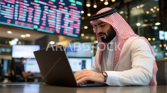 Financial charts presentation, Business management and organization via technical devices, Integrating work with technology, Office professions and jobs, Saudi Arabian Gulf businessman wearing traditional dress and shemagh working on laptop, Working in the economic field