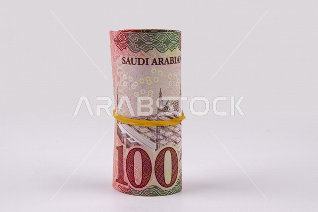 صورة لرزمة نقود سعودية، العملة الورقية السعودية، خلفية، الريال السعودي من فئة المائة