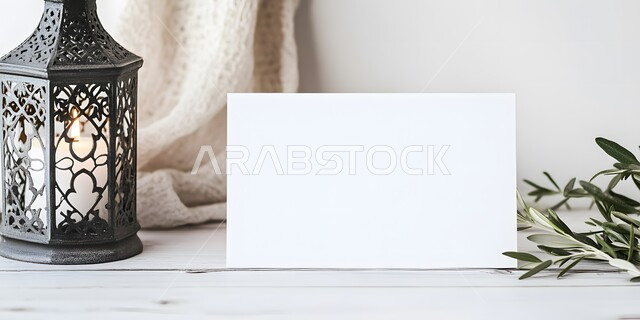 An empty white board next to a Ramadan lantern, the concept of celebrating Islamic religious occasions and holidays in the Kingdom of Saudi Arabia, traditional metal lanterns, decorations and decorations for the blessed Ramadan, the joy of the arrival of the month of goodness, the distinctive spiritual atmosphere