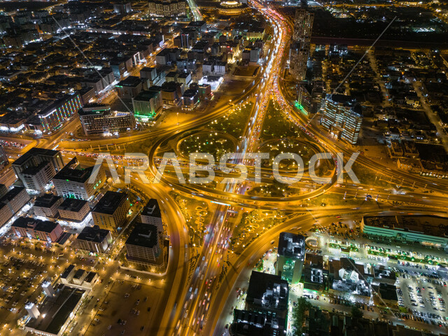 Architectural engineering of towers and skyscrapers, intersection of King Fahd Road and Northern Ring Road in the capital, aerial photo of traffic in Rabat Square at night, famous roads and streets in Saudi Arabia