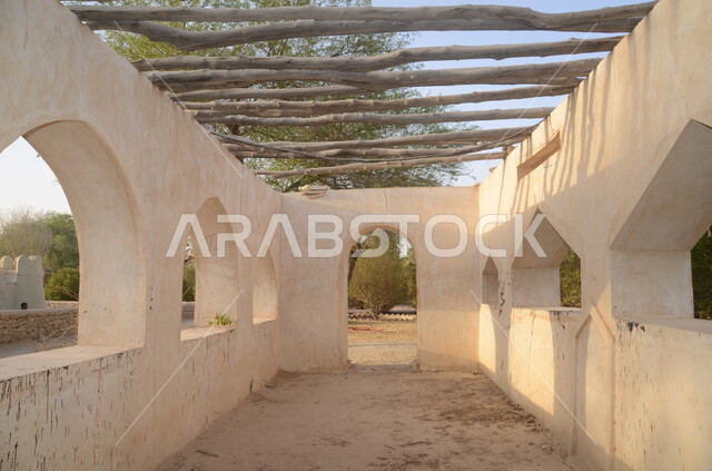 An ancient mosque made of clay and white stone, the Juwata Mosque in the Al-Ahsa region of the Kingdom of Saudi Arabia, old-style architecture, Islamic and worship, historical religious archaeological sites