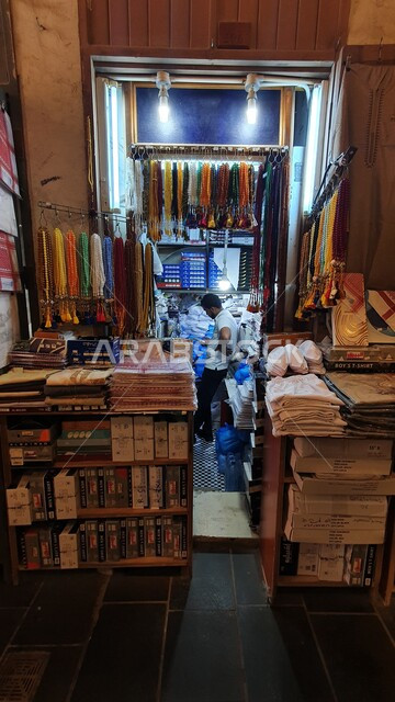 Local national products, the concept of elegance among Arabs, colorful fabrics in the markets, a store selling traditional folk clothes, Souq Waqif in Doha, Qatar