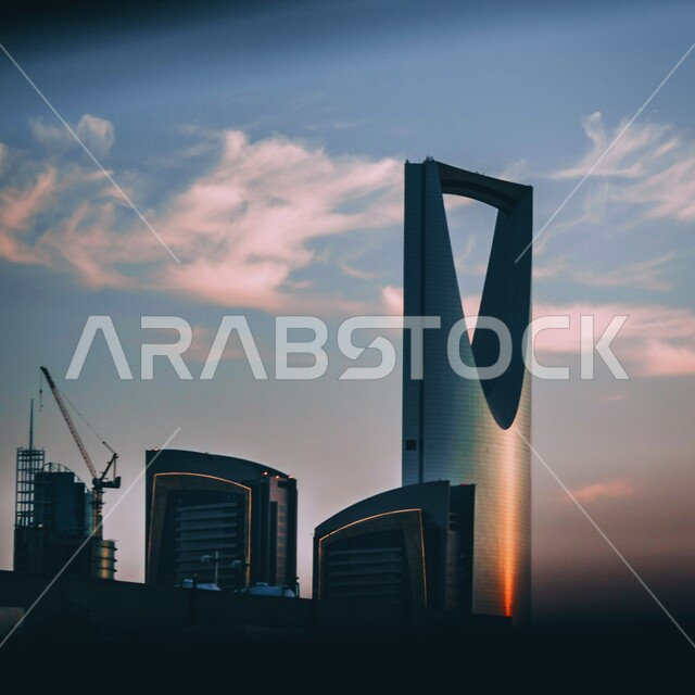 Urban development and growth in the Kingdom of Saudi Arabia, the architectural art of towers and skyscrapers in the capital, the Kingdom Tower building in Riyadh during the day, famous tourist attractions