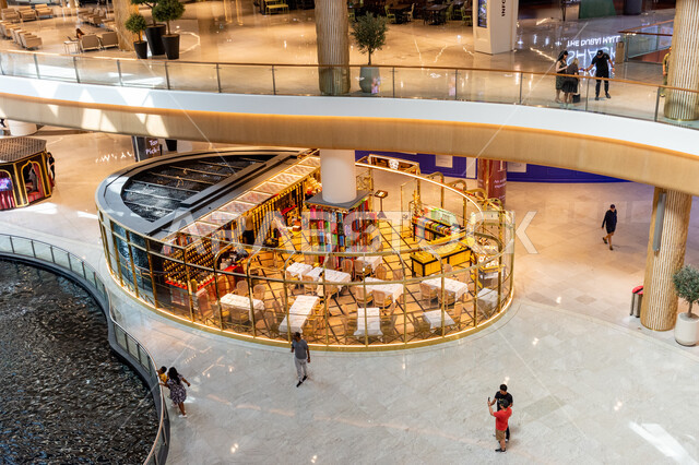 Perfume shops inside Dubai Mall, perfuming and using beautiful scents, a kiosk selling luxury perfumes, famous tourist attractions in Dubai, attracting and attracting tourists from all over the world, tourism in the United Arab Emirates, family shopping destinations