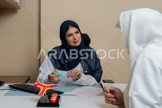 Viewing test results, providing consultations in medical centers in the United Arab Emirates, following up on patients' medical records, working in health sectors, a veiled Gulf Arab Emirati female doctor wearing a medical coat describing the patient's medical condition, women's professions and jobs