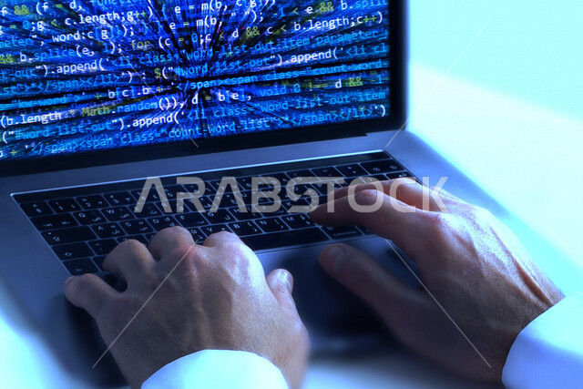 A young Saudi Gulf working as a web developer, using programming languages, developing and building websites and electronic applications, codes and algorithms, and computer technologies